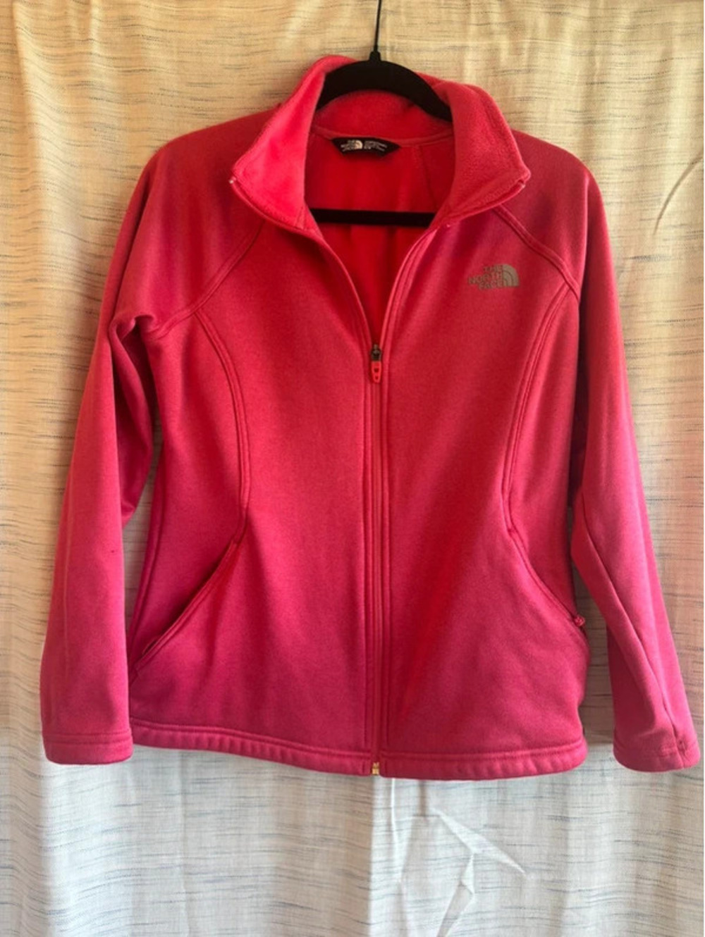 Medium pink woman’s north face jacket